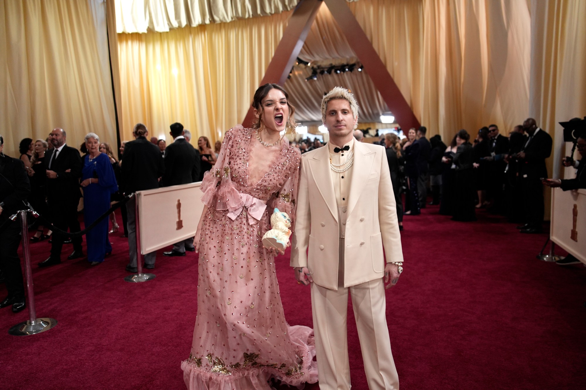 Charlotte Lawrence, left, and Andrew Watt arrive at the Oscars on Sunday, March 2, 2025, at the Dolby Theatre in Los Angeles. (AP Photo/John Locher)