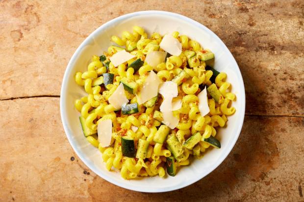 This image released by Milk Street shows a recipe for zucchini pasta with saffron. (Milk Street via AP)