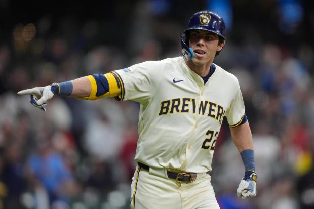 Milwaukee Brewers' Christian Yelich gestures after hitting a walk off grand slam during the 10th inning of a baseball game against the Boston Red Sox, Tuesday, May 27, 2025, in Milwaukee. (AP Photo/Aaron Gash)