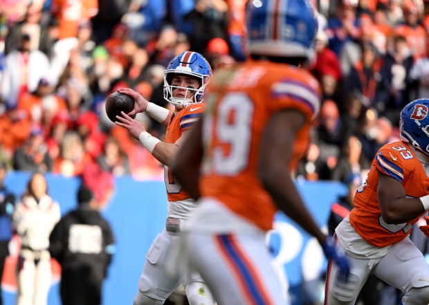 Denver Broncos quarterback Bo Nix (10) looks to pass to Denver Broncos wide receiver Marvin Mims Jr. (19) during the first half of the game against the Kansas City Chiefs at Empower Field at Mile High in Denver on Jan. 5, 2025.  The Denver Broncos take on the Kansas City Chiefs in their last bid for a playoff opportunity. (Photo by Helen H. Richardson/The Denver Post)