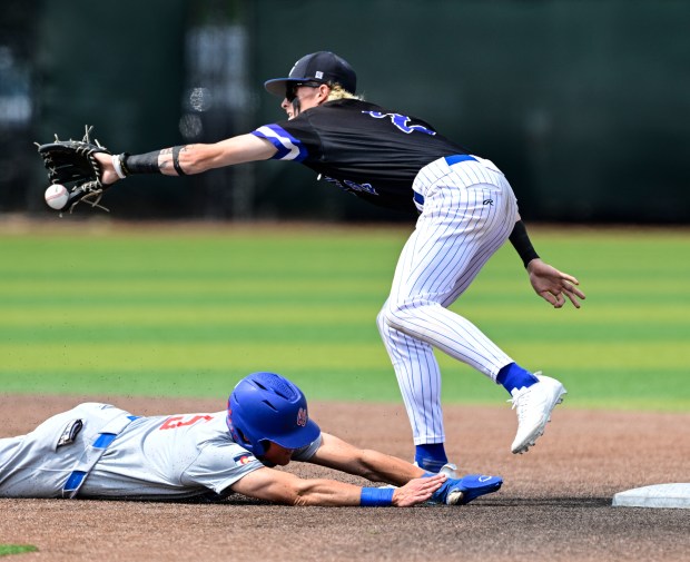 Cherry Creek's Sean Goldy, left, heads back to second safely against Grandview's Chase Chapman in the second inning of their Class 5A state baseball semifinal at All-Star Park in Lakewood on Saturday, May 24, 2025. (Photo by Andy Cross/The Denver Post)
