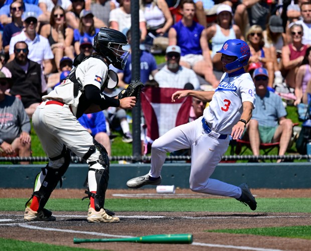 Cherry Creek Bruins Tyson Thome (3) scores against Regis Jesuit Raiders catcher Nick Wiley (3) on a sacrifice fly hit by teammate Ryan Neumann (24) in the third inning of the Class 5A State Baseball Championship Game at All-Star Park in Lakewood, Colorado, on Saturday, May 31, 2025. (Photo by Andy Cross/The Denver Post)