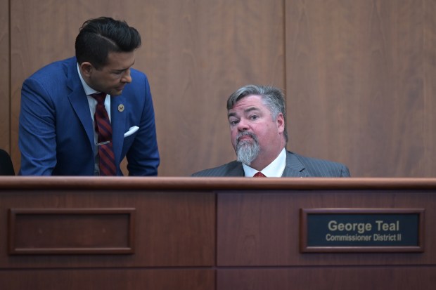 Commissioner Abe Laydon of district I, left, talks with commissioner George Teal of district II at Douglas County Government office in Castle Rock, Colorado on Tuesday, March 25, 2025. Douglas County has engaged in a series of legal battles with the state over property tax valuations, state immigration laws and the validity of public health orders, like mask mandates during the coronavirus pandemic. (Photo by Hyoung Chang/The Denver Post)