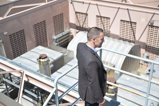 Brian LaComb, area vice president at Expedient, looks at backup generators at the company's data center in Centennial on May 12, 2025. (Photo by RJ Sangosti/The Denver Post)