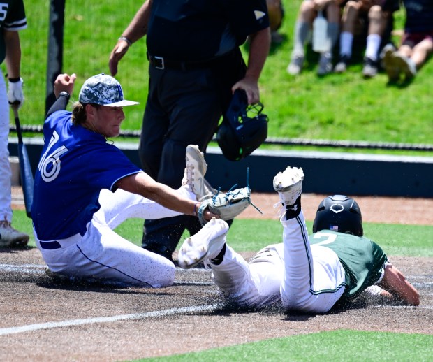 Mason Griffin, Fossil Ridge, (2) out at home plate by Broomfield Eagles starting pitcher Maverick Scarpella, (16) in the first inning during the class 5A state baseball tournament at All-Star Park in Lakewood, Colorado on Friday, May 23, 2025. (Photo by Andy Cross/The Denver Post)