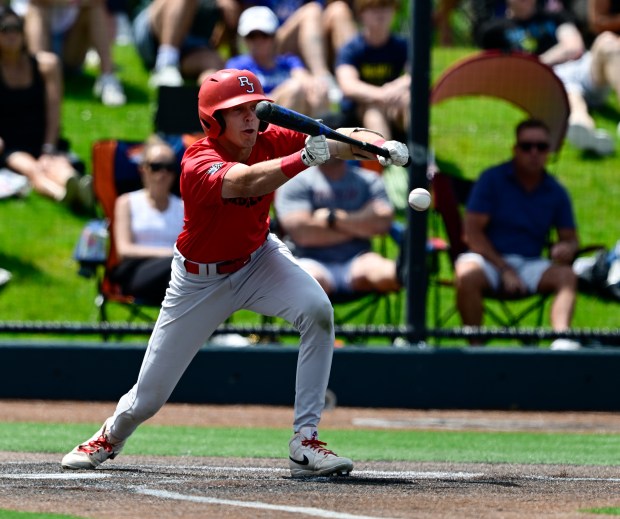 Regis Jesuit's Gavin Cronin (18) hits a suicide squeeze against Grandview in the sixth inning during their Class 5A state baseball consolation semifinal at All-Star Park in Lakewood on Friday, May 30, 2025. (Photo by Andy Cross/The Denver Post)