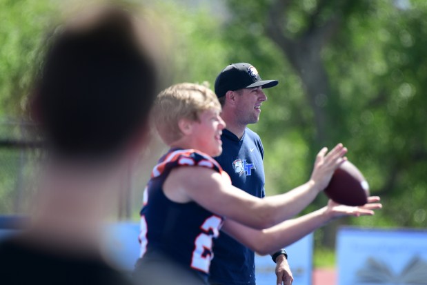 Legend High School head coach Jake Heaps, right, runs a youth football camp in Parker, Colorado, on Friday, June 6, 2025. (Photo by Hyoung Chang/The Denver Post)