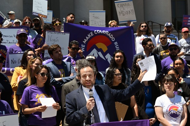 David Seligman, Executive Director for Towards Justice, holds a subpoena in his hands as he speaks during a press conference at the County Building in Denver on June  9, 2025. (Photo by Helen H. Richardson/The Denver Post)
