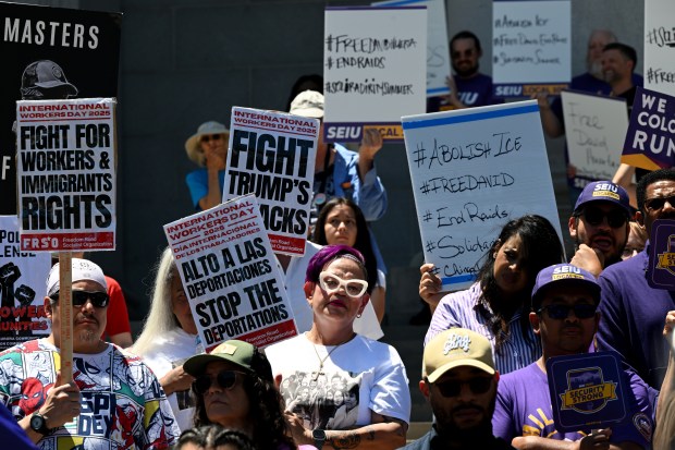 Rally-goers hold signs during a rally and news conference on the east steps of the City and County Building in Denver on June 9, 2025. Labor and civil rights leaders held the event in response to continuing immigration crackdowns by federal authorities and a dispute over whether Colorado should comply with an ICE subpoena. (Photo by Helen H. Richardson/The Denver Post)