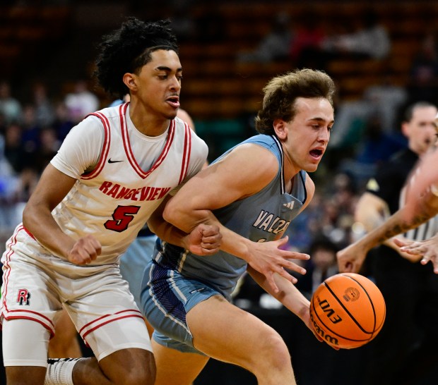 Cole Scherer (1) of the Valor Christian Eagles drives to the hoop against Archie Weatherspoon V (5) of the Rangeview Raiders in the first half of the state high school boys 6A Final 4 game at the Denver Coliseum in Denver on Thursday, March 13, 2025. (Photo by Andy Cross/The Denver Post)