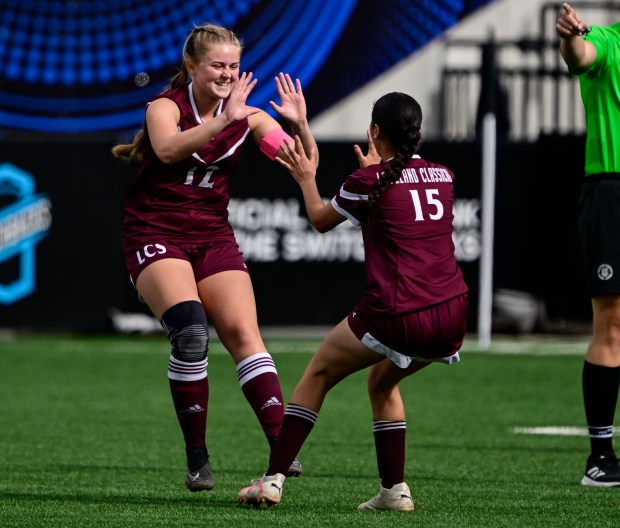 Abby Ruppert, (12), Loveland Classical, celebrates with her teammate Gigi Gonzalez (15) after Ruppert scored a goal against Flatirons Academy in the first half of the girls 2A state soccer championship game at Weidner Field in Colorado Springs, Colorado on Wednesday, May 21, 2025. (Photo by Andy Cross/The Denver Post)