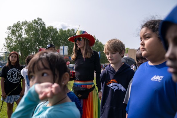 Physical education teacher Kelly Donnelly and students gather during Field Day at Ashley Elementary School in Denver., on Friday, May 30, 2025. (Eli Imadali/Special to The Denver Post)