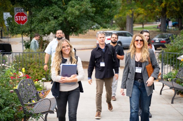Angela Wirkler, left, and Charlene Hoffman of Visit Boulder lead a group of Boulder and Sundance Institute leaders on a site visit on Oct. 16, 2024. (Zach Lucas, New Legends Media)