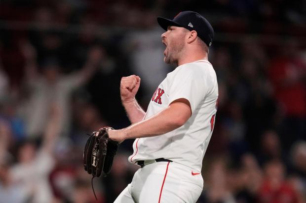 Boston Red Sox pitcher Liam Hendriks celebrates after the final out of a baseball game against the Minnesota Twins at Fenway Park, Friday, May 2, 2025, in Boston. (AP Photo/Charles Krupa)