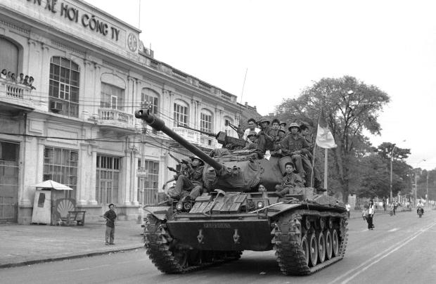 FILE- Tank of the PRG is driven through Saigon's Tong Nhut Street on May 1, 1975. (AP Photo/Frances Starner, File)