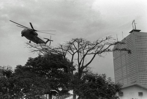 File- A U.S. Marine helicopter lifts off from the landing pad atop the U.S. Embassy during the evacuation of Saigon Wednesday, April 30, 1975. (AP Photo/Phu, File)